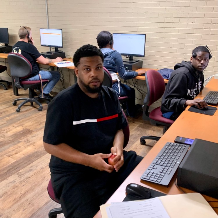 Photo of students working on computers in our Jacksonville classroom.